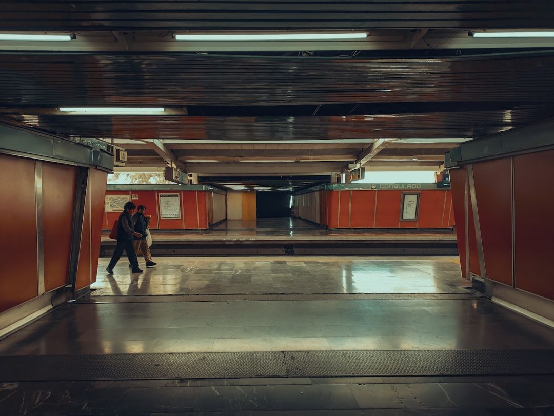Commuters on a Mexico City metro platform during the day